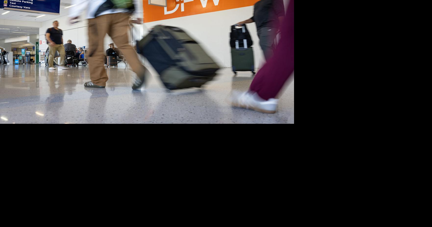 Airline travelers exit baggage claim in Terminal E at Dallas Fort Worth International Airport on Sept. 11, 2025.