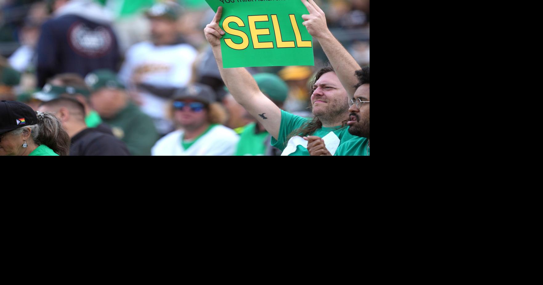 MLB video crops out A's fans' John Fisher protest signs