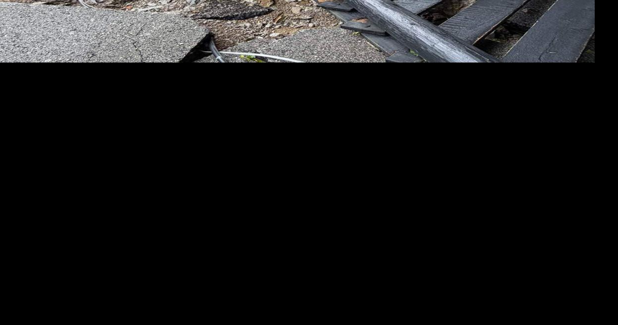 A residential driveway near Tates Creek Road in Madison County is destroyed as a result of Saturday flooding.