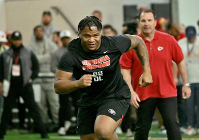 Georgia's defensive lineman Jalen Carter runs in front of coaches and scouts.