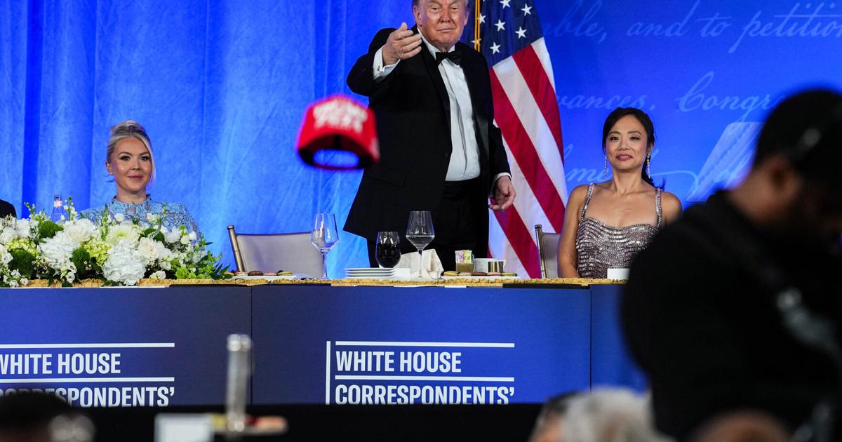 U.S. President Donald Trump tosses his TRUMP 2028 hat to an attendee during the re-scheduled White House Correspondents Dinner in the Presidential Ballroom at the Waldorf Astoria on Friday, July 24, 2026, in Washington, D.C..