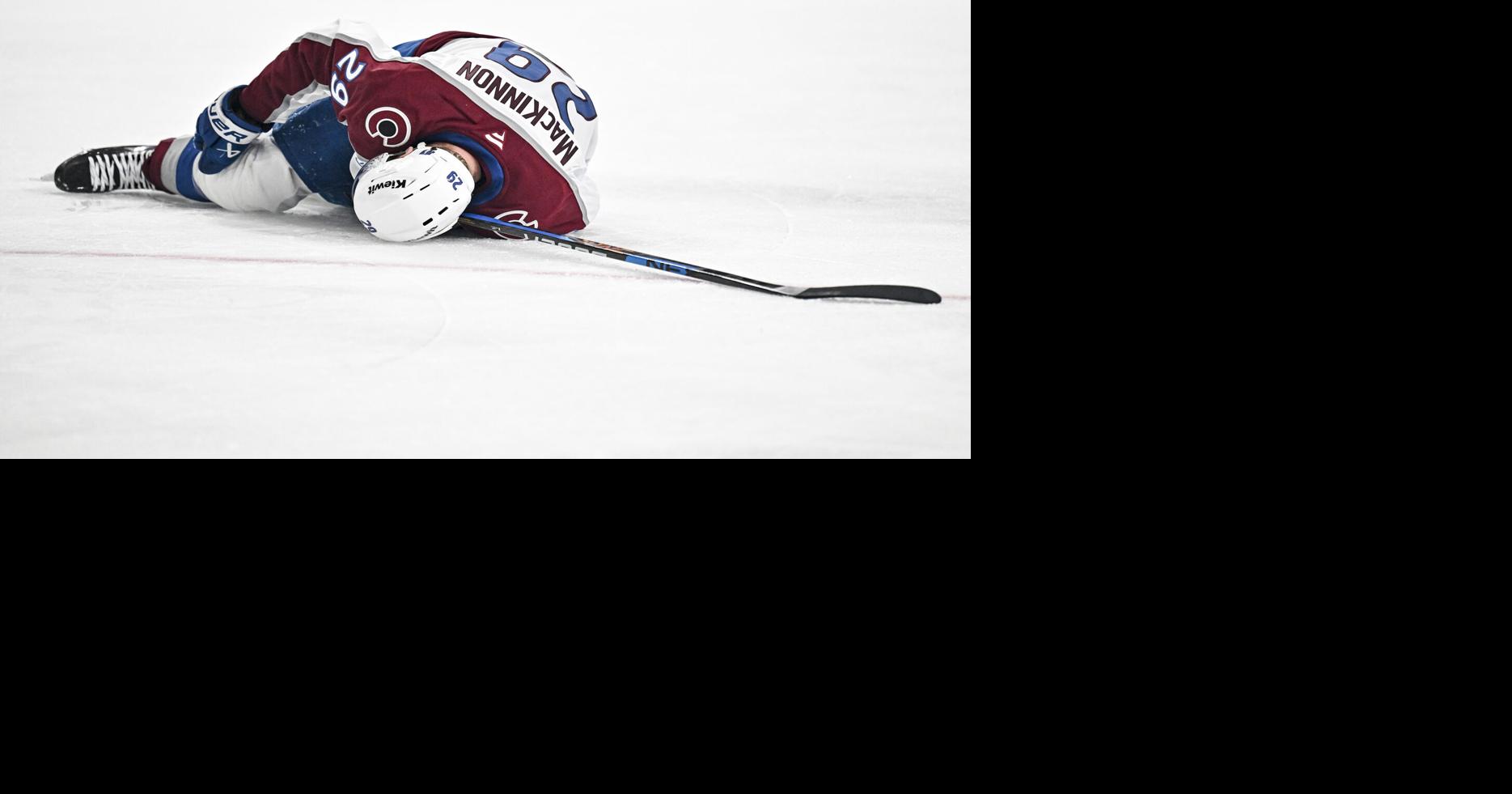 Nathan MacKinnon of the Colorado Avalanche writhes in pain before exiting the game during the second period of Game 3 of the NHL Western Conference Final against the Vegas Golden Knights at T-Mobile Arena in Las Vegas on Sunday, May 24, 2026.