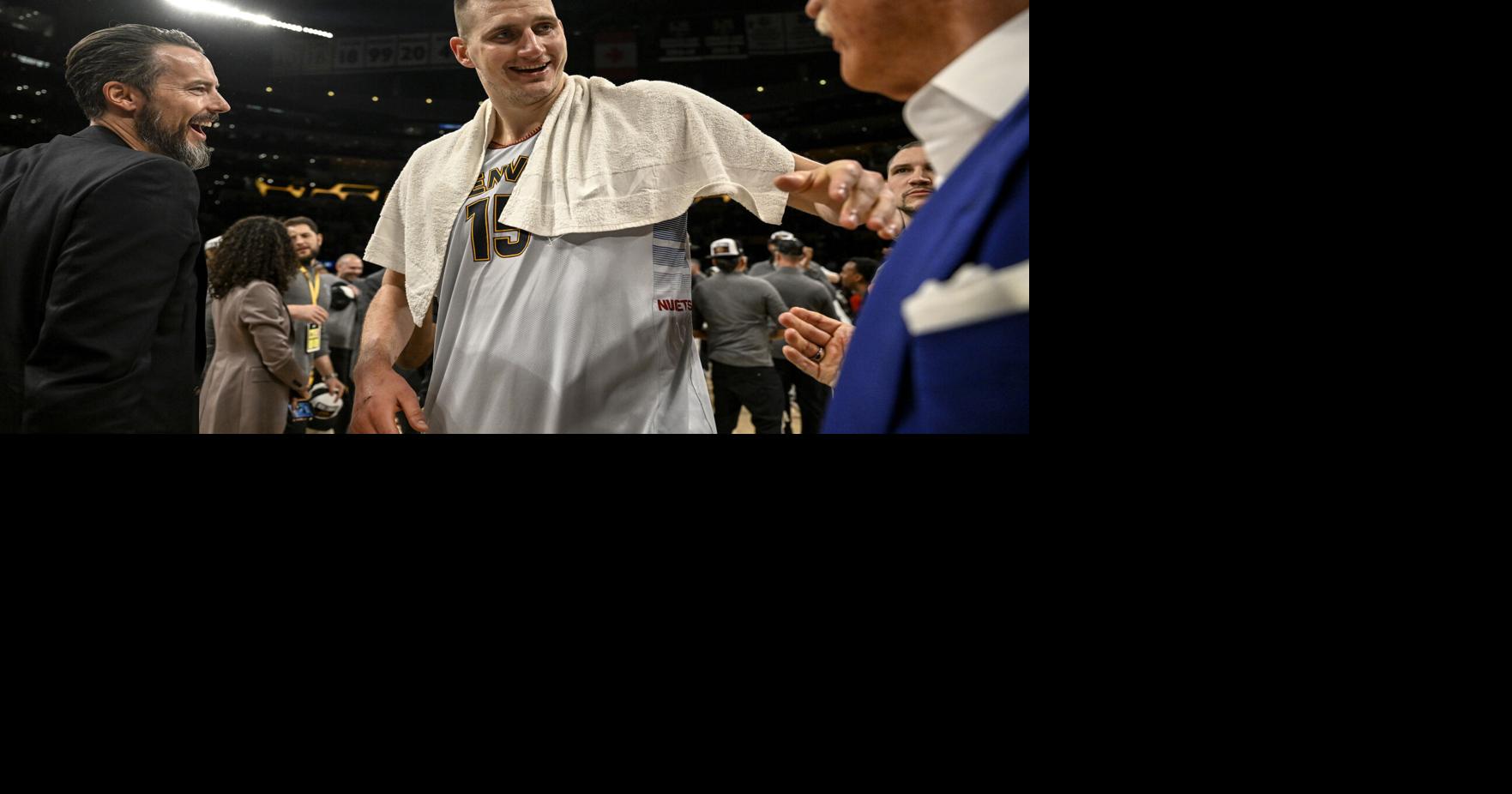 Nikola Jokic of the Denver Nuggets celebrates with team governor Josh Kroenke and team owner Stan Kroenke after the fourth quarter of the Nuggets' 113-111 Western Conference finals game 4 win over the Los Angeles Lakers at Crypto Arena in Los Angeles on Monday, May 22, 2023.