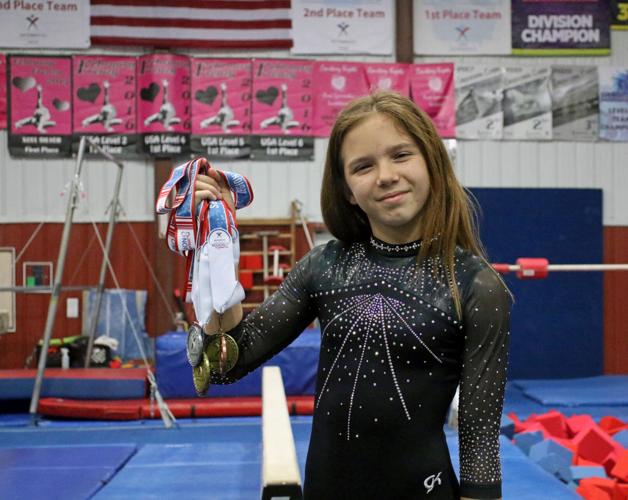 Local gymnast brings home gold, silver from Eastern Championships