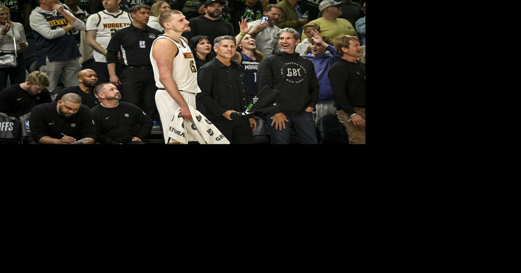 Nikola Jokic of the Denver Nuggets stands on the sideline as the Minnesota Timberwolves crowd chants 