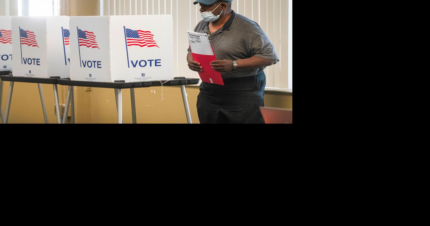 A voter completes his ballot during early voting at the Northwest Activities Center on July 27, 2024, in Detroit.
