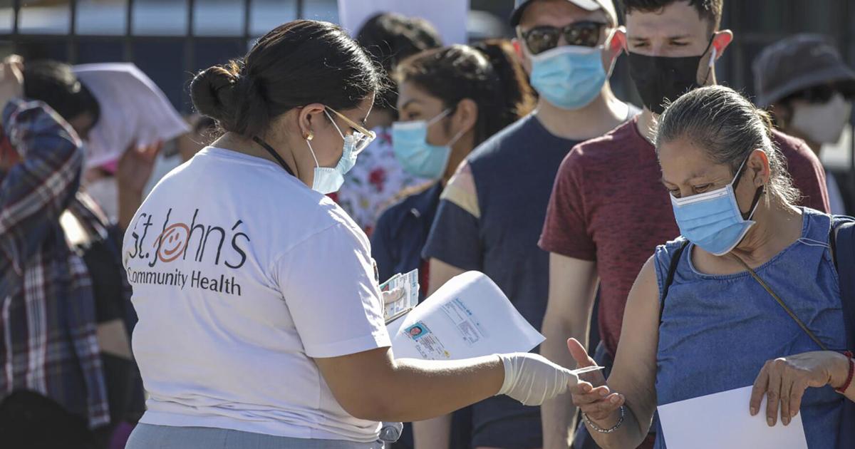 People wait in line to get Monkeypox virus vaccine at St.John' s Well Child& Family Center on Aug. 10, 2022, in Los Angeles.