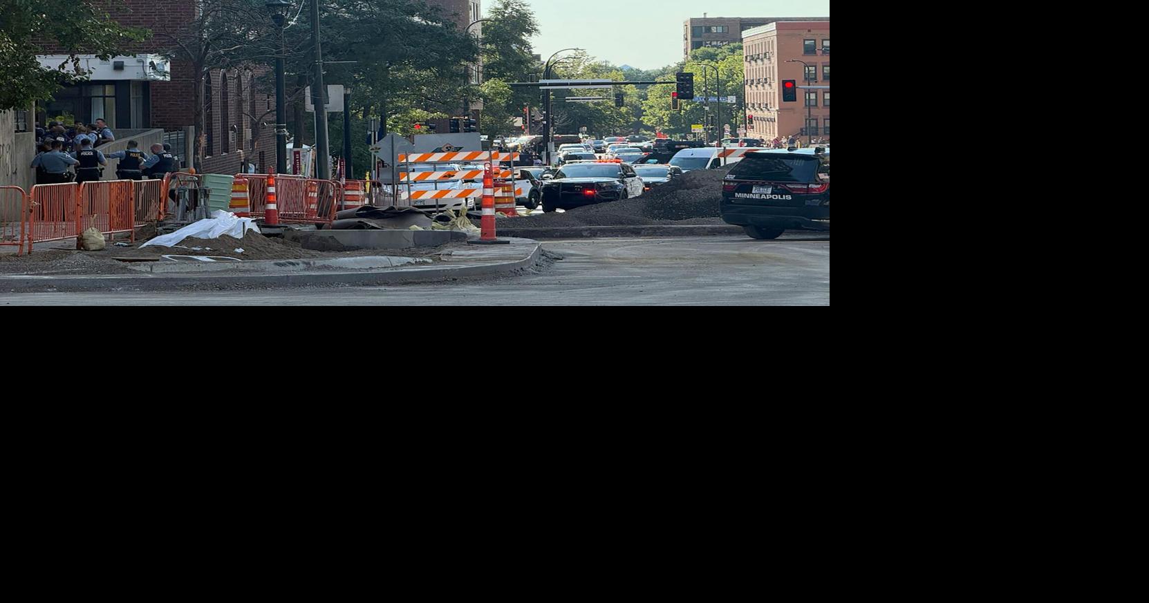 Numerous officers stand at the base of Shoreline Plaza where a shooting has taken place on Wednesday, Sep. 2, 2026, in Minneapolis.