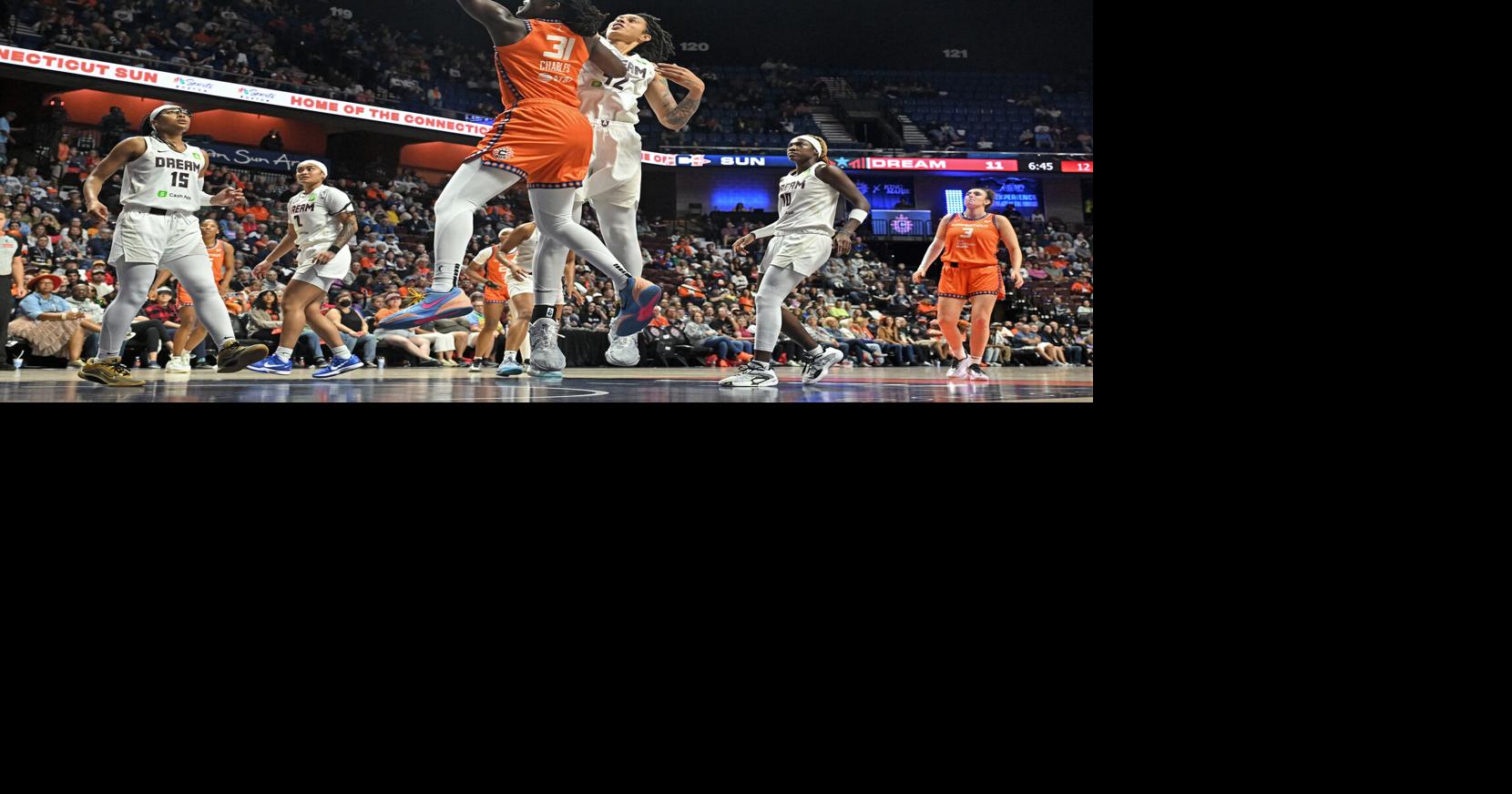 Tina Charles #31 of the Connecticut Sun shoots and scores ahead of Brittney Griner #42 of the Atlanta Dream in the first half at Mohegan Sun Arena on Sept. 10, 2025, in Uncasville, Connecticut.
