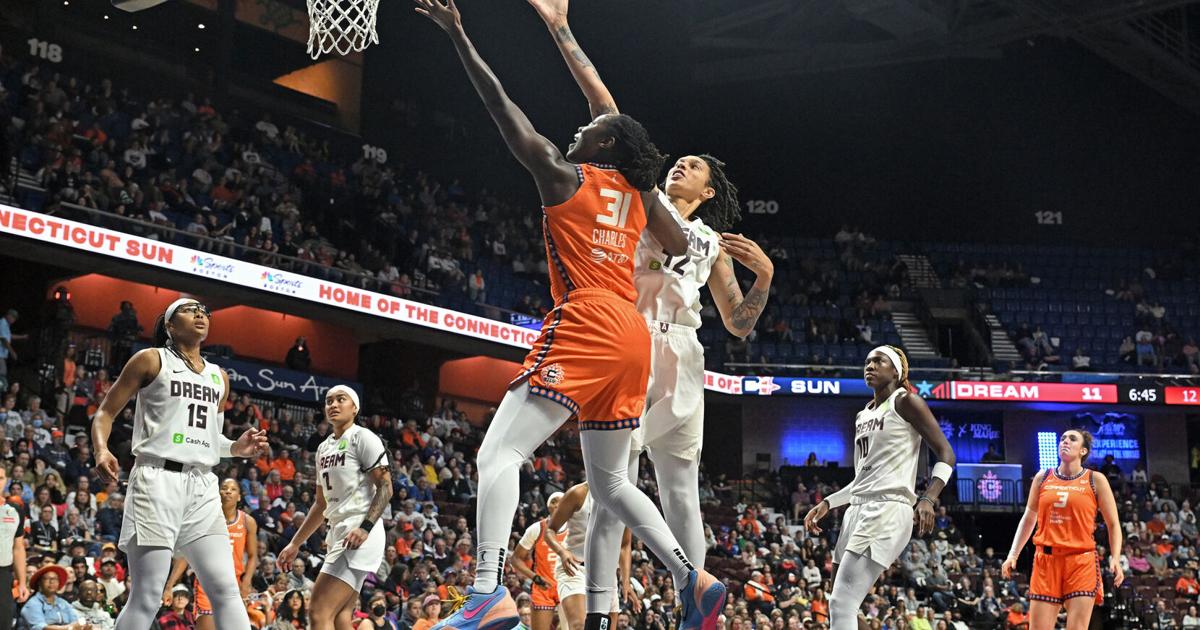 Tina Charles #31 of the Connecticut Sun shoots and scores ahead of Brittney Griner #42 of the Atlanta Dream in the first half at Mohegan Sun Arena on Sept. 10, 2025, in Uncasville, Connecticut.