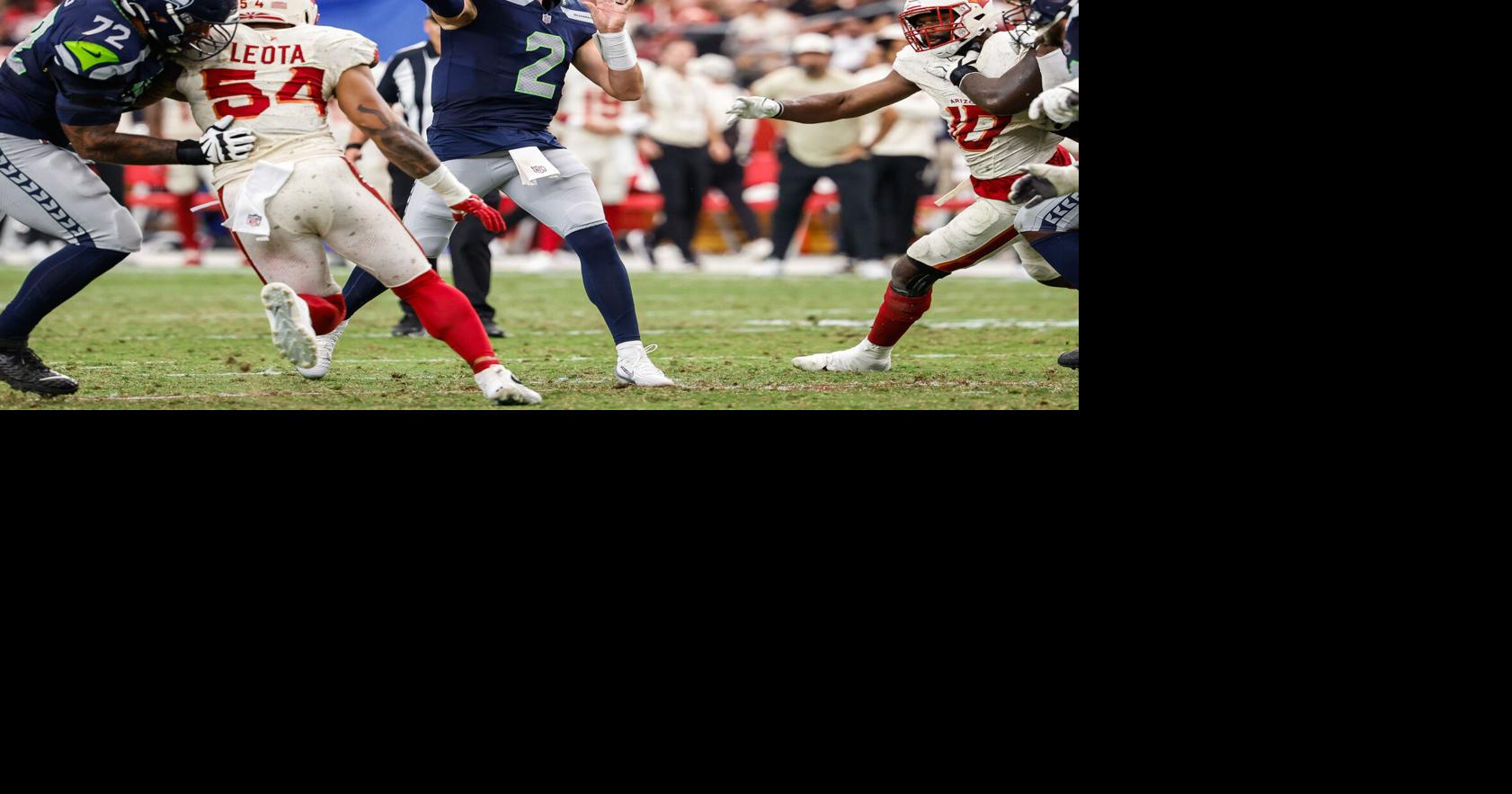 Seattle Seahawks quarterback Drew Lock hits Jaxon Smith-Njigba for a 12- yard touchdown in the fourth quarter against the Arizona Cardinals Sunday, Sept. 20, 2026, at State Farm Stadium, in Glendale, Ariz..