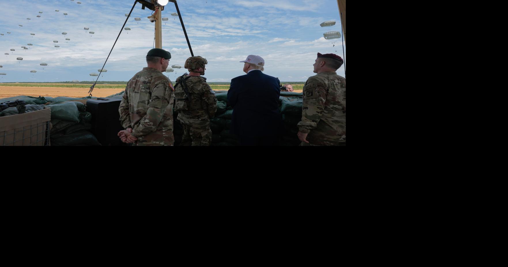 Gregory Anderson, right, and other military and civilian leaders as they watch a demonstration by Special Operations soldiers at the Holland Drop Zone on Tuesday, June 10, 2025, in Fort Bragg, North Carolina.
