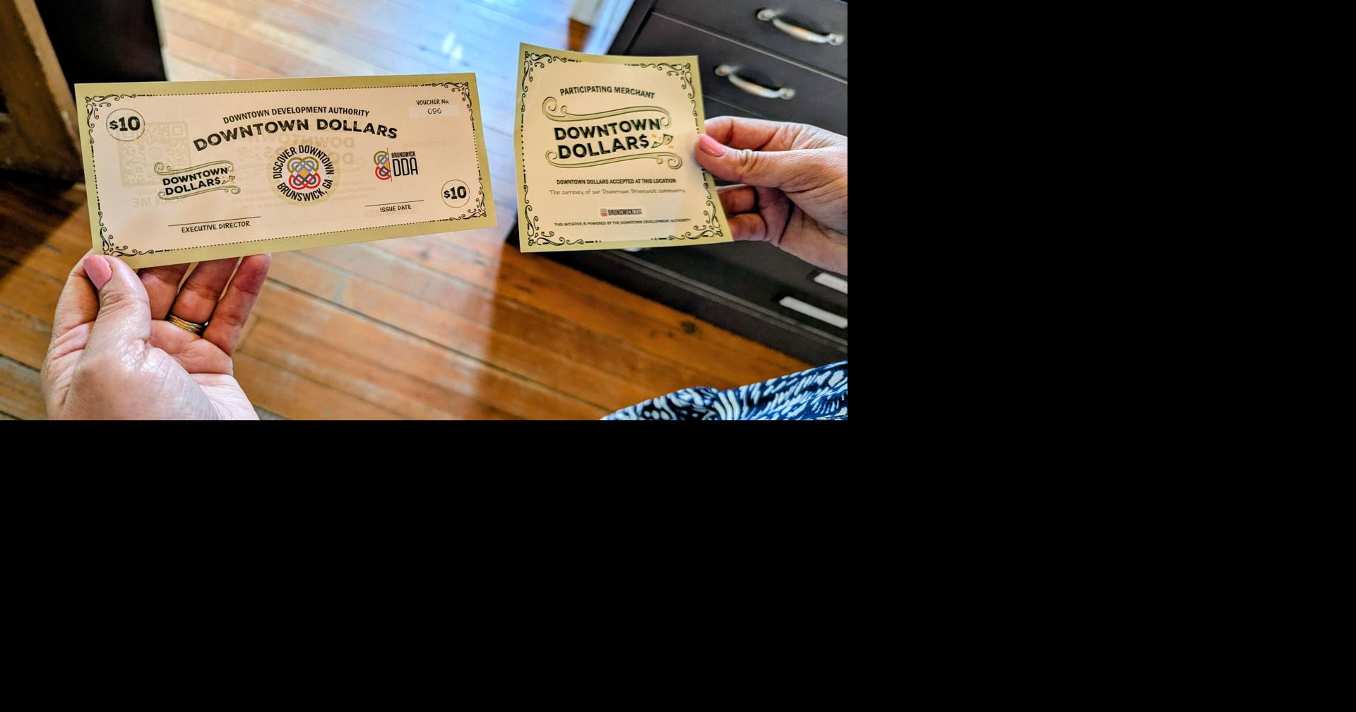 Customers support local businesses with Downtown Dollars