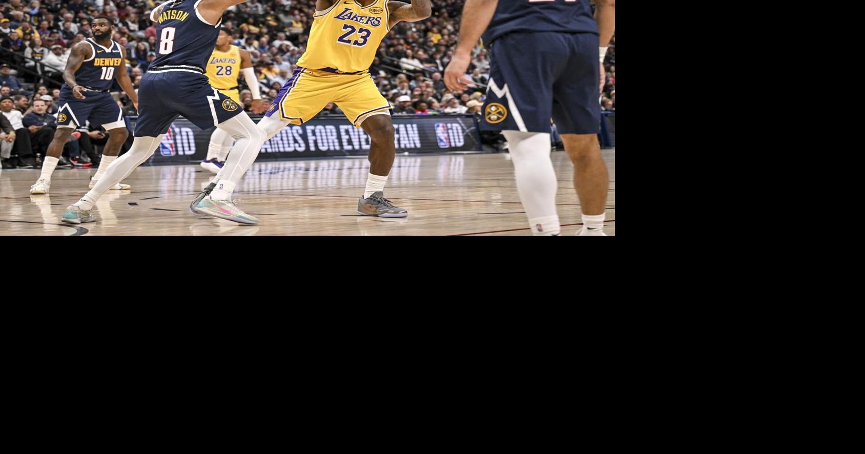 The Los Angeles Lakers' LeBron James works against the Denver Nuggets' Peyton Watson during the third quarter at Ball Arena in Denver on Jan. 20, 2026.