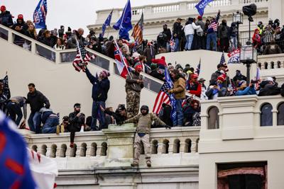 Pro-Trump supporters storm the U.S. Capitol following a rally with President Donald Trump on Wednesday, Jan. 6, 2021, in Washington, D.C. Congress held a joint session today to ratify President-elect Joe Biden's 306-232 Electoral College win over Presid...