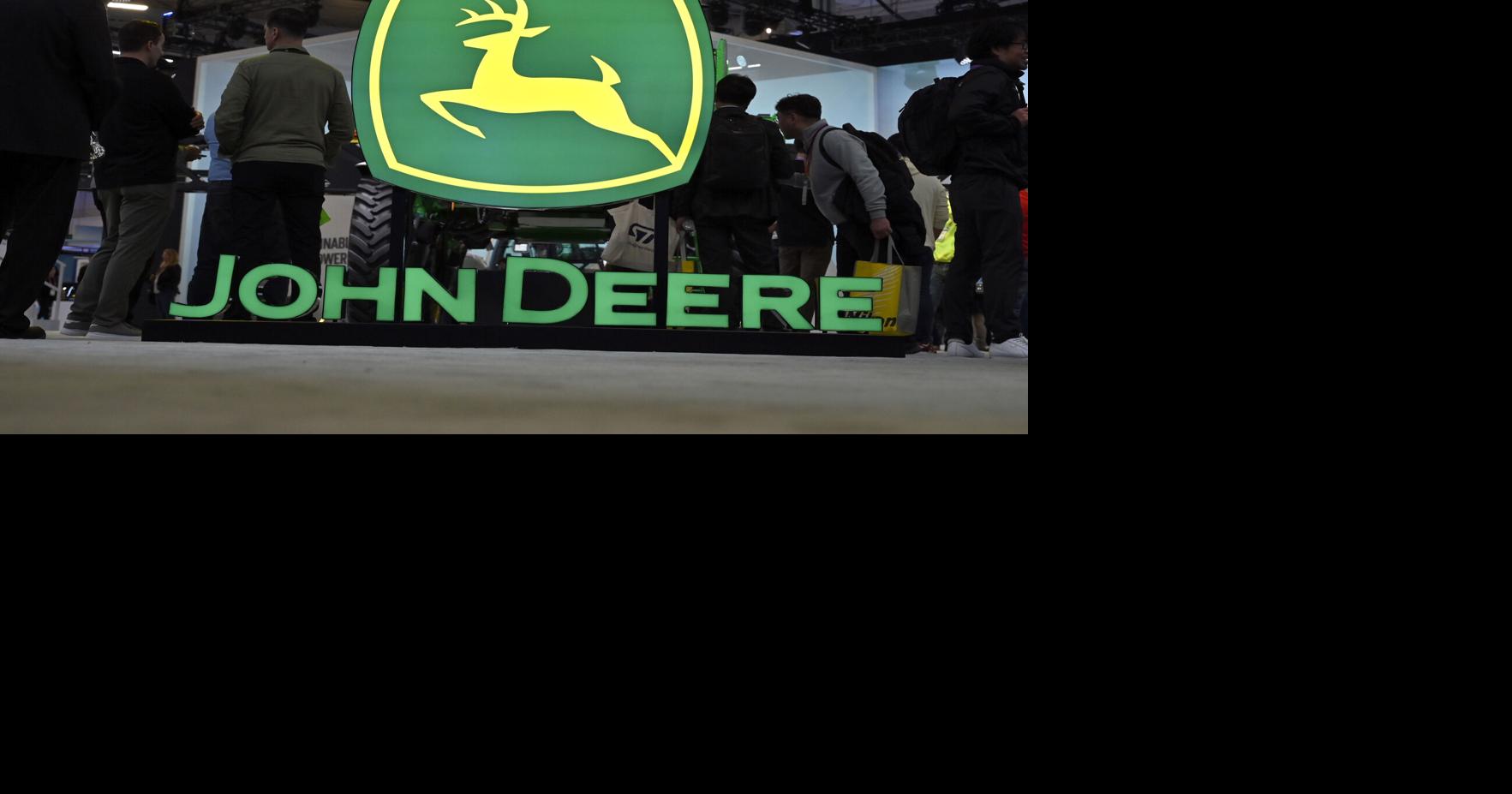 John Deere booth signage is displayed at CES 2023 at the Las Vegas Convention Center on Jan. 6, 2023, in Las Vegas.