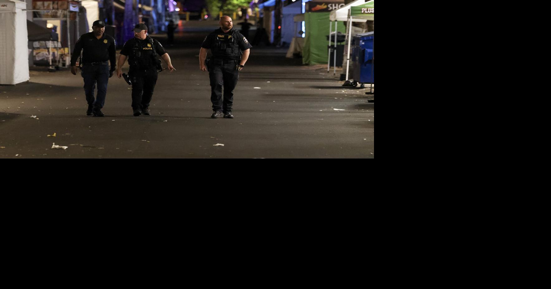 Seattle police officers work the scene of a mass shooting at Seattle Center during Bite of Seattle on Sunday, July 26, 2026.