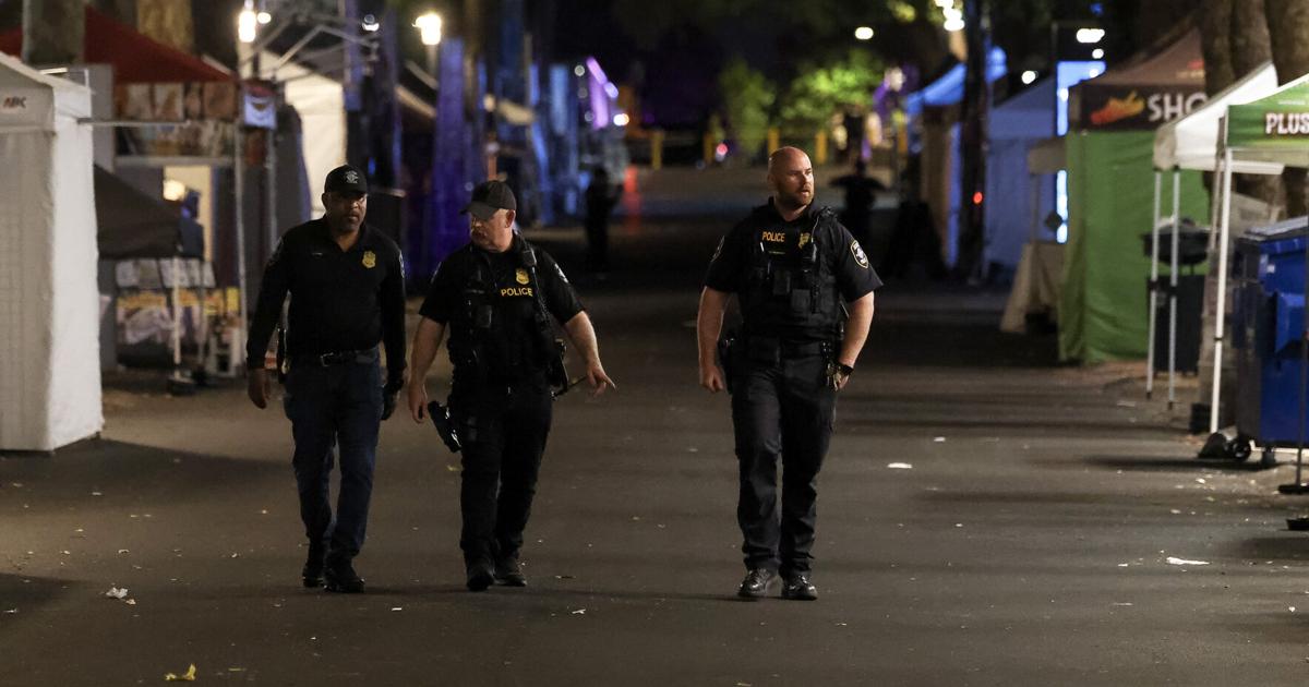 Seattle police officers work the scene of a mass shooting at Seattle Center during Bite of Seattle on Sunday, July 26, 2026.