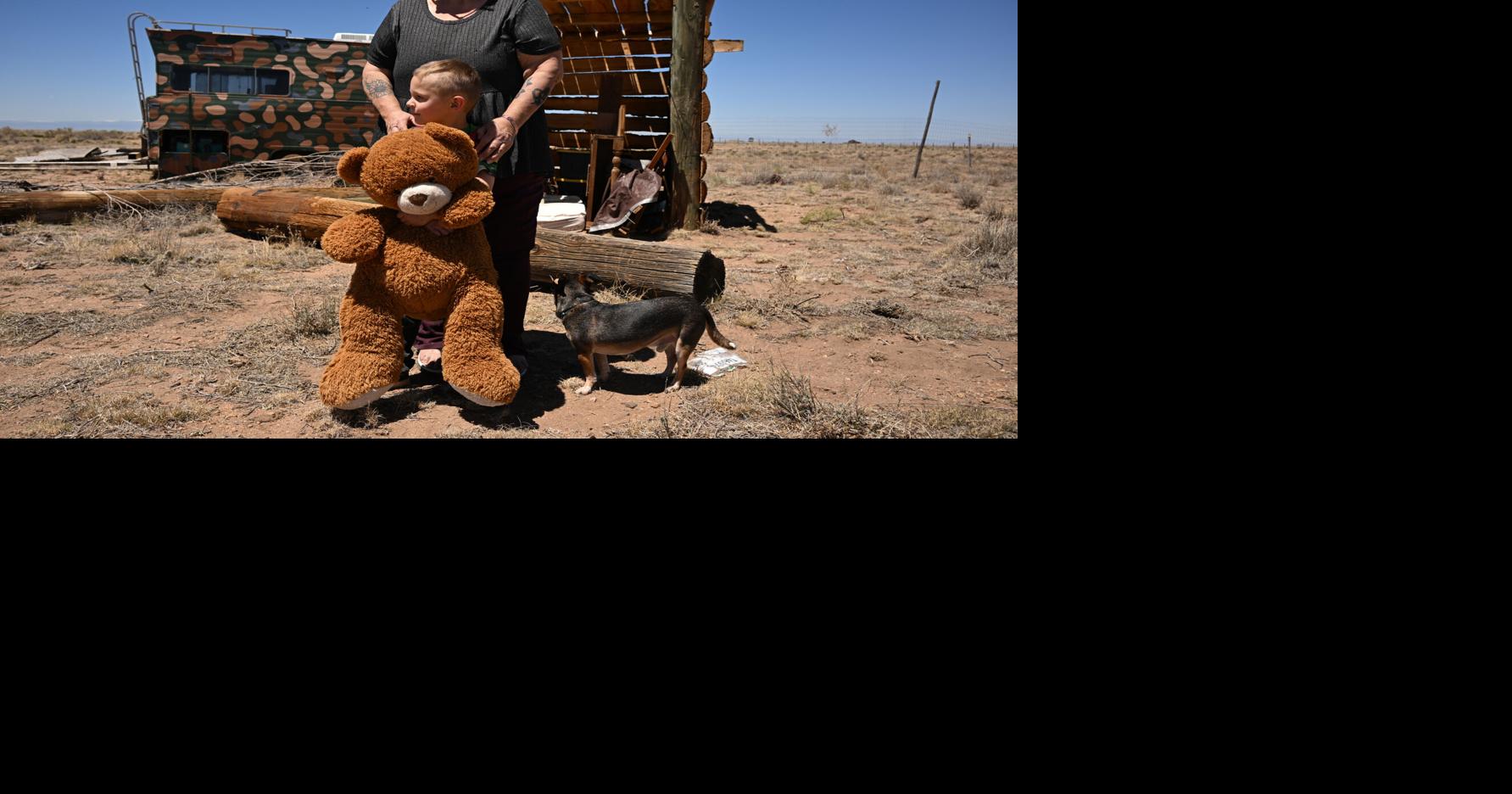 Kim Wisdom stands with her great-grandson, Lucipher Desrochers, 4, at her family’ s property on May 11, 2026, in Costilla County, Colorado.