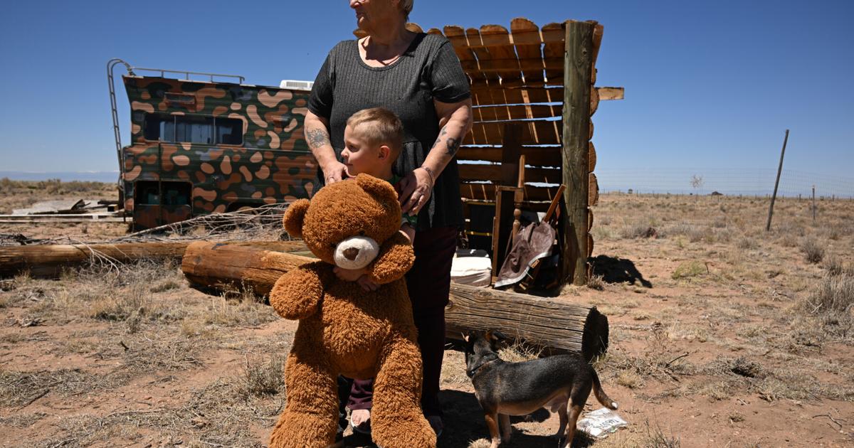 Kim Wisdom stands with her great-grandson, Lucipher Desrochers, 4, at her family’ s property on May 11, 2026, in Costilla County, Colorado.