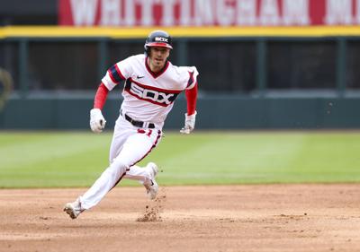 Chicago White Sox first baseman Andrew Vaughn, right, walks next