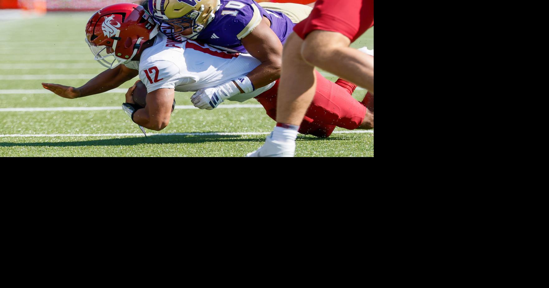 Washington Huskies linebacker Xe'ree Alexander gets to Washington State Cougars quarterback Caden Pinnick during the second quarter Sunday, Sept. 6, 2026, at Husky Stadium in Seattle.