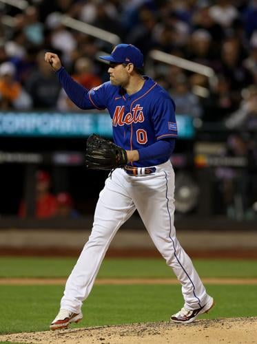 Adam Ottavino of the New York Mets delivers a pitch in the eighth inning  against the