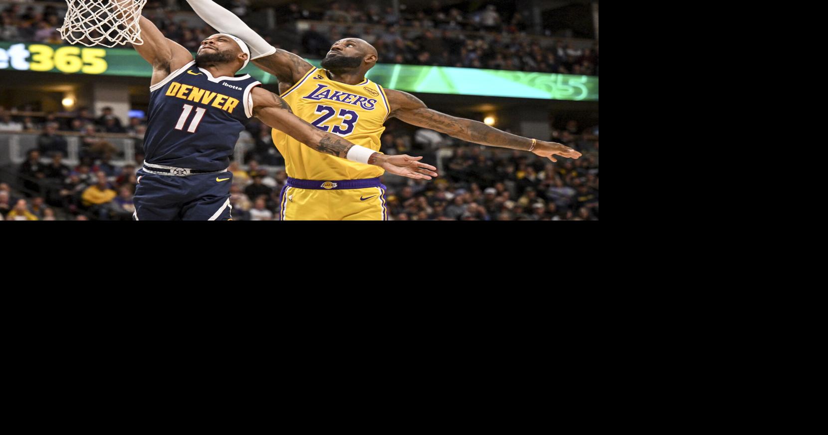 LeBron James of the Los Angeles Lakers runs down Bruce Brown of the Denver Nuggets to force a miss during the second quarter at Ball Arena in Denver on Thursday, March 5, 2026.