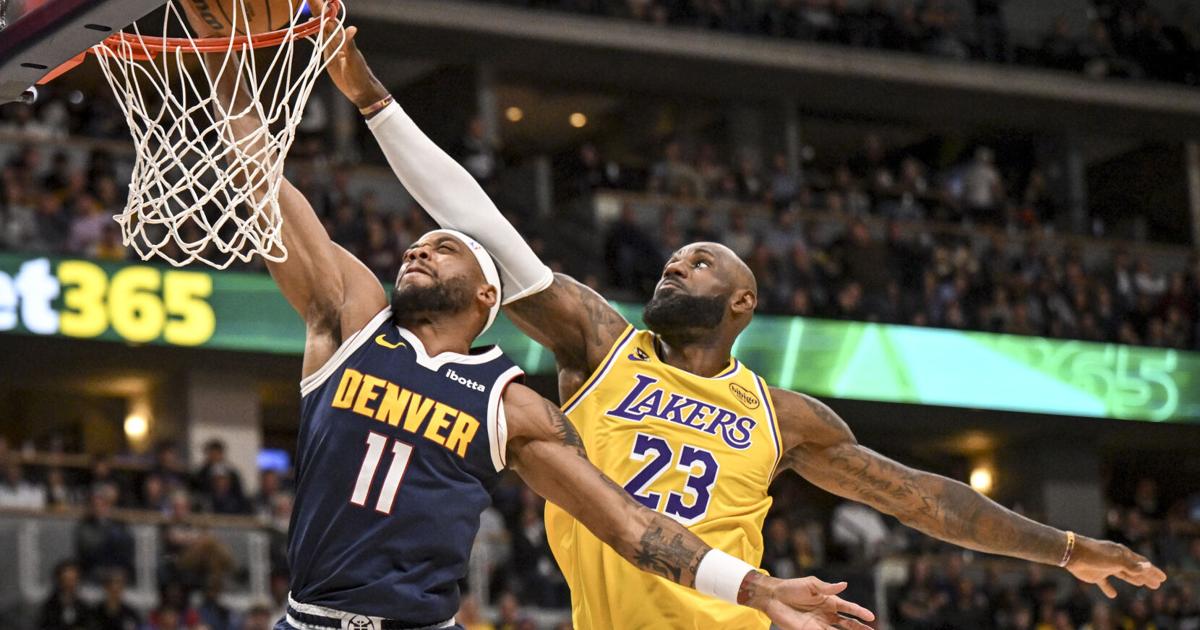 LeBron James of the Los Angeles Lakers runs down Bruce Brown of the Denver Nuggets to force a miss during the second quarter at Ball Arena in Denver on Thursday, March 5, 2026.