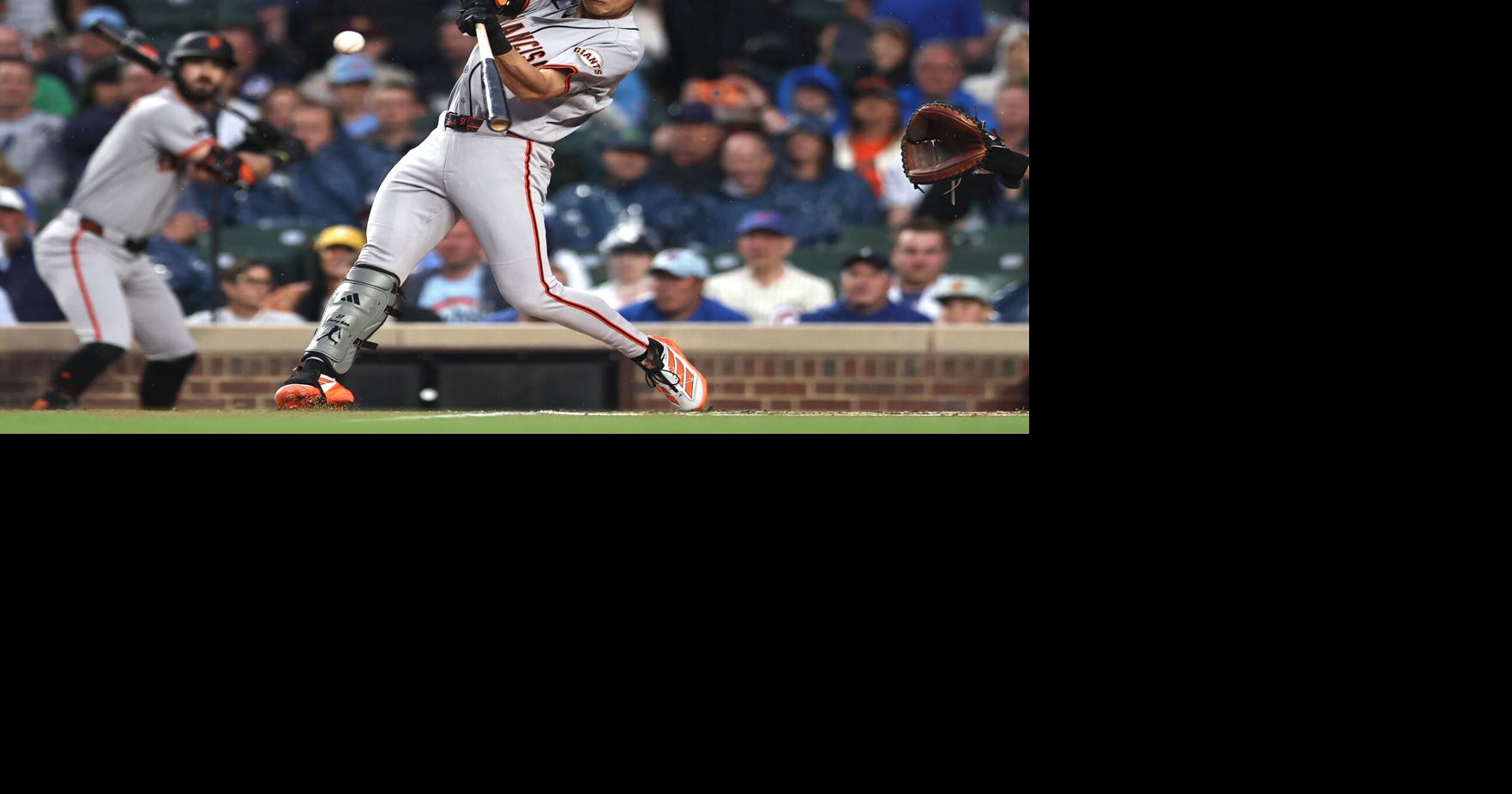 Jung Hoo Lee of the San Francisco Giants hits an RBI single during the first inning against the Chicago Cubs at Wrigley Field on June 7, 2026, in Chicago.