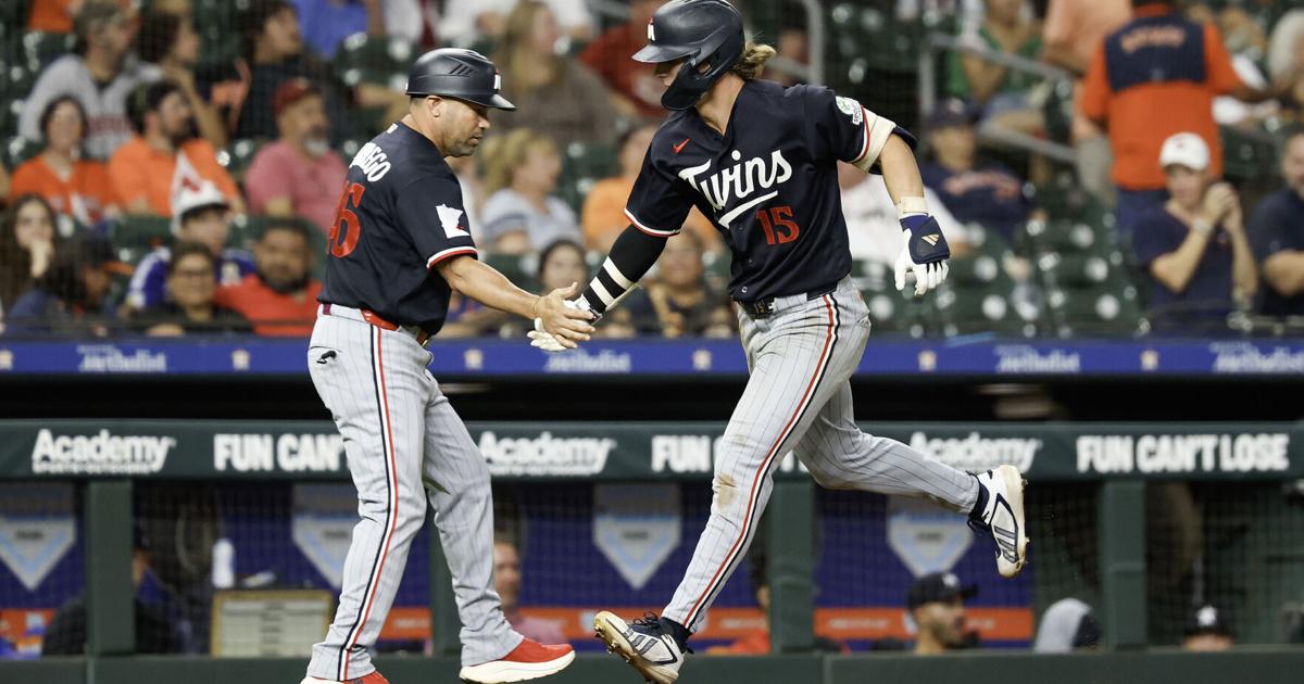 The Minnesota Twins' Luke Keaschall celebrates with third base coach Ramon Borrego hitting a solo home run during the eighth inning against the Houston Astros at Daikin Park on Wednesday, July 1, 2026, in Houston.