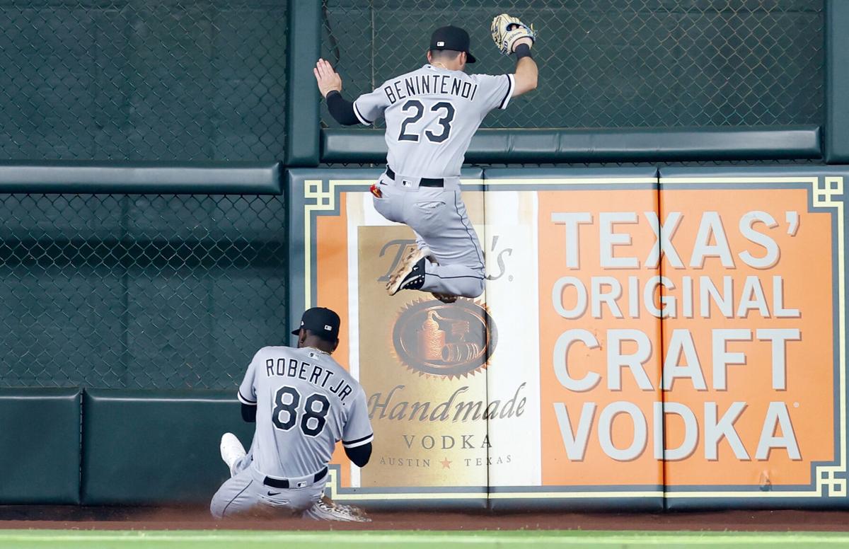 Luis Robert Jr. #88 and Andrew Benintendi of the Chicago White Sox