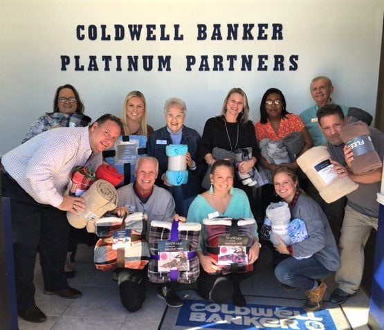 Coldwell Banker distributes blankets Community Life