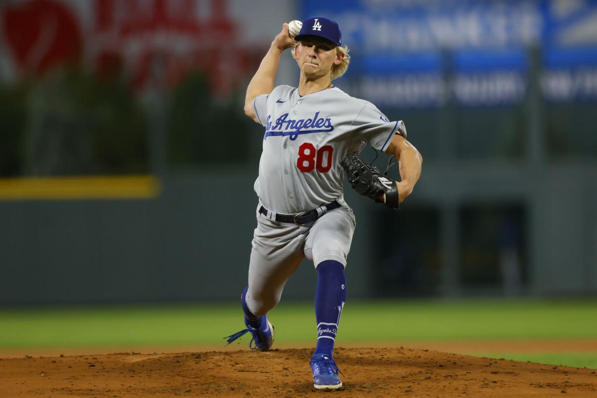 Dodgers come up swinging after weather delay to rout Rockies, National  Sports