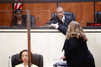 Kathleen McDaniel, a lawyer for Planned Parenthood, hands documents to Judge Clifton Newman on Friday, May 26, 2023, in the Richland County Courthouse in Columbia, South Carolina.