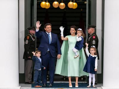 Ron DeSantis and his family wave to the crowd during the inauguration ceremony at the historic Florida Capitol in Tallahassee on Jan. 3, 2023.