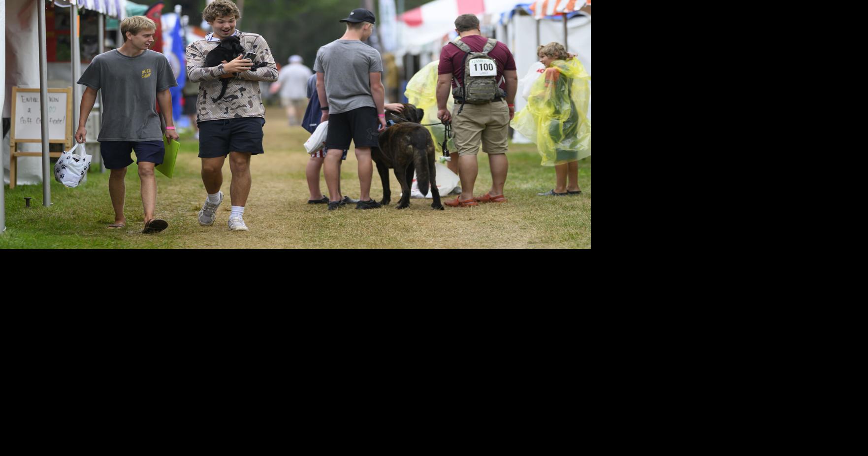 Holden Gilbertson, 17, of Delano, Minnesota, takes a selfie with his yet-to-be-named eight-week old black lab after buying it on Aug. 7, 2026, at Game Fair in Ramsey, Minnesota.