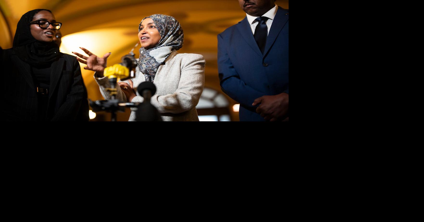 Ilhan Omar and other Somali-American elected leaders take questions from the press after a press conference in response to Donald Trump's announcement that he would revoke Temporary Protected Status for Somalis in Minnesota on November 24, 2025, at the Minnesota State Capitol in St. Paul, Minnesota.
