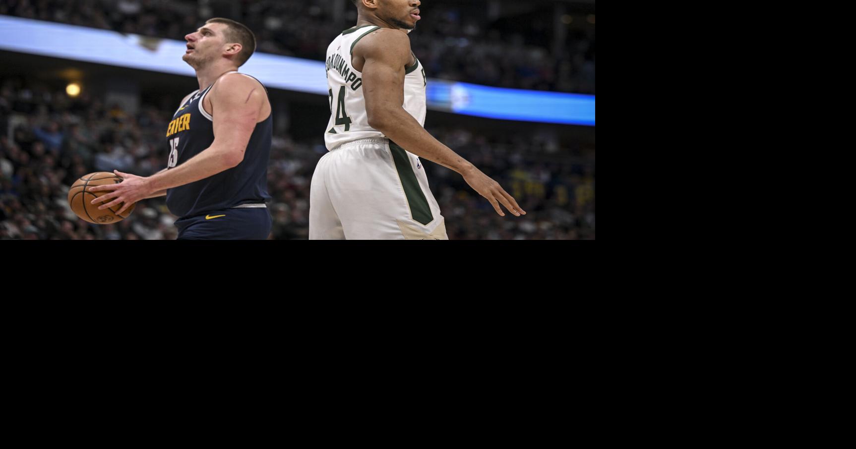 Giannis Antetokounmpo of the Milwaukee Bucks reacts to fouling Nikola Jokic of the Denver Nuggets during the third quarter at Ball Arena in Denver on Monday, Jan. 29, 2024.