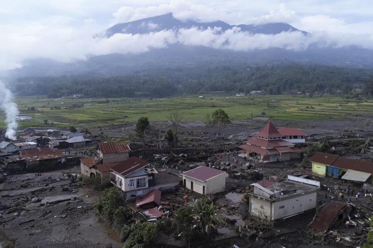 Indonesian rescuers search through rivers and rubble after flash floods that killed at least 50