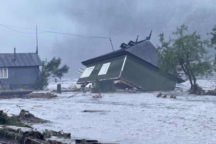 Flash floods in Romania kill at least 3 people and force hundreds of evacuations