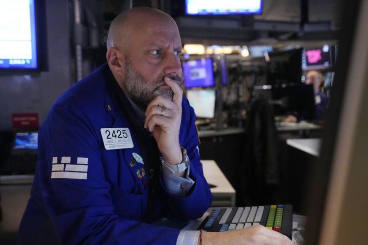 Wall Street falls in a manic day after briefly dropping more than 10% below its record