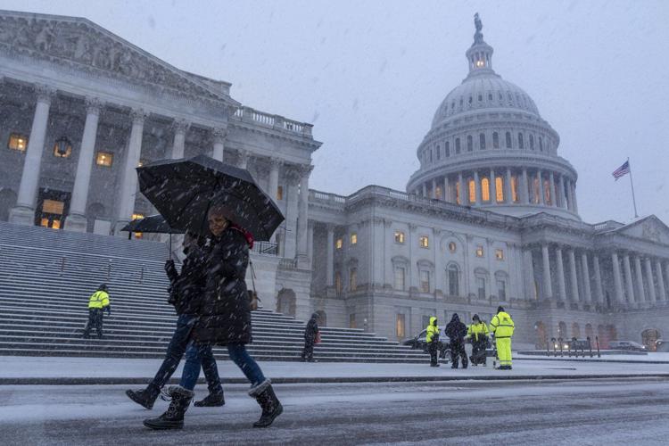 Snow and freezing rain cause crashes in Virginia while California prepares for likely flooding