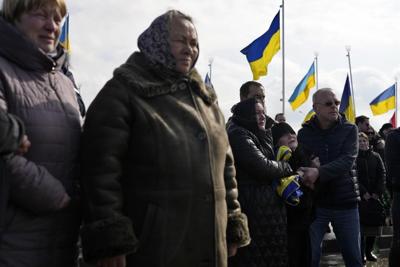 'Oh my daughter': Volunteer medic, 29, buried in Ukraine