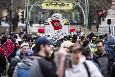 Mock beheading of Quebec labour minister at May Day protest draws outrage