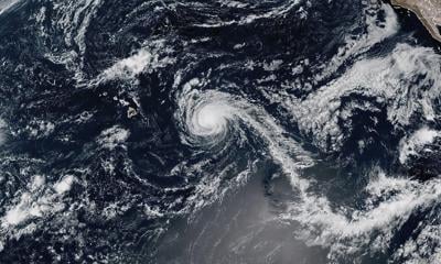 Kiko weakens into a tropical storm but still could create dangerous surf in Hawaii