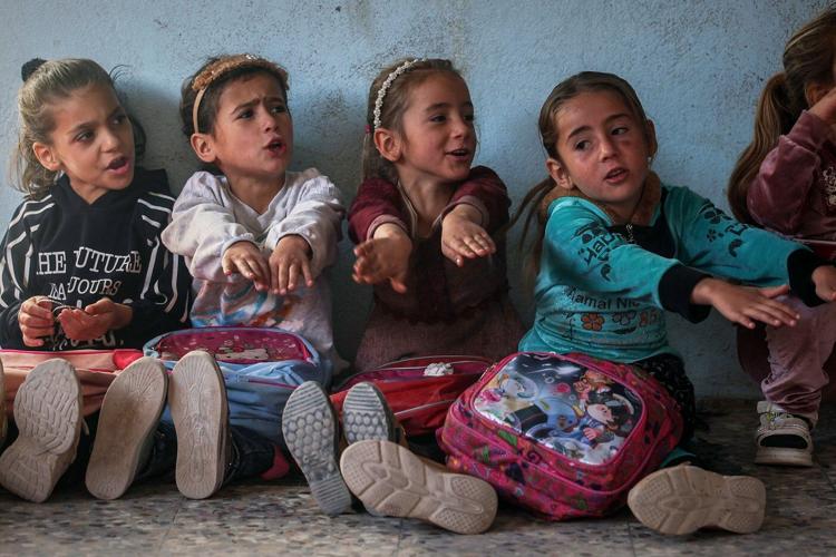Photos show Syrian students returning to schools stripped bare by conflict