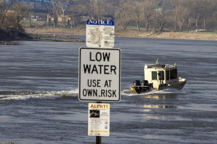 Nebraska officials search the Missouri River near Omaha for two teens and a child