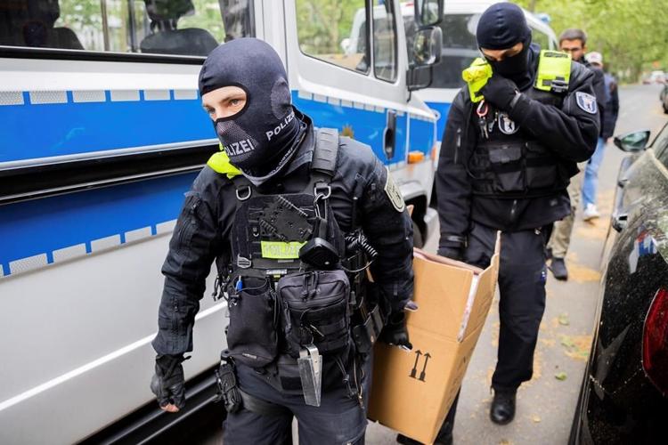 German police conduct raids on climate activists as impatience mounts