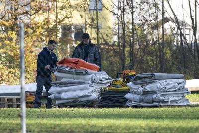 In asylum dispute, Austrian mayor takes down migrant tents